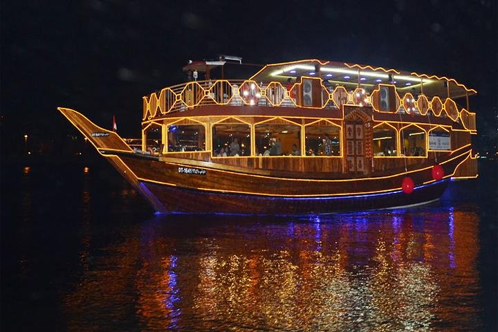 Float along Dubai Creek aboard a beautifully illuminated dhow savoring a delightful buffet dinner while enjoying live music and mesmerizing tanoura dance under the moonlit sky.